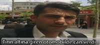 Tırın altına giren otomobilde can verdi