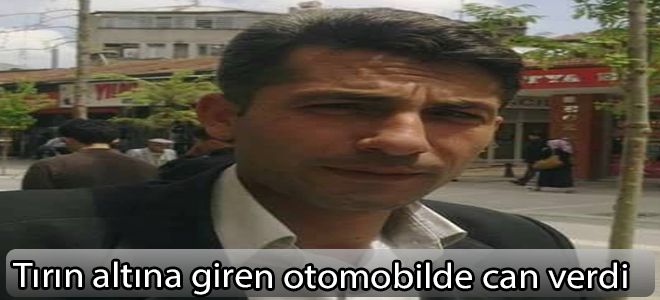 Tırın altına giren otomobilde can verdi